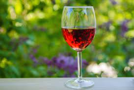 a glass of red Organic wine