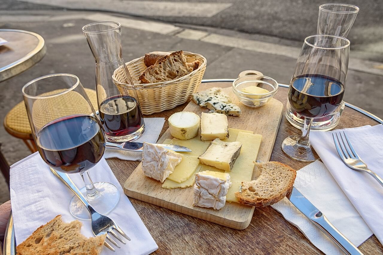 Organic red wine with artisan cheese and fresh bread for clean eating